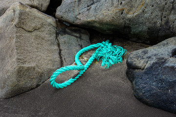 green ship rope on a coast
