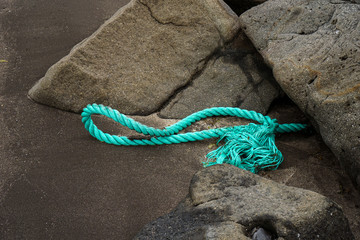 green ship rope on a coast