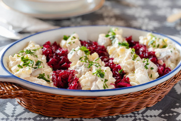 Salted herring in a creamy sauce with pear, potatoes, onions, beets and cranberries.