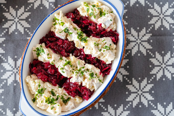 Salted herring in a creamy sauce with pear, potatoes, onions, beets and cranberries.
