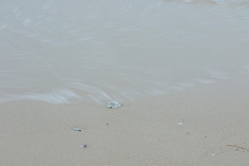 Sandy beach with flowing Sea water Slow motion