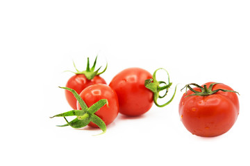 ripe fresh organic tomatoes in drops of dew isolated on white background