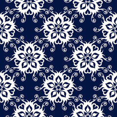 Dark blue background. White floral seamless pattern