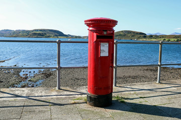 Fototapeta na wymiar Old Royal Mail Post Box at a Seaside Location in Scotland