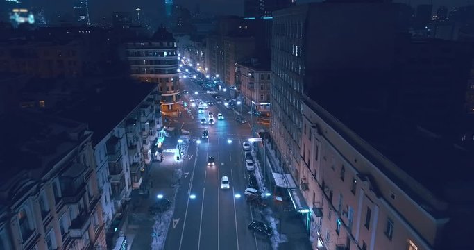 Top down aerial view of night streets in downtown Kyiv, Ukraine, with bright night lighting. Wide shot on dji mavic 2 pro hasselblad camera with smooth cinematic drone motion