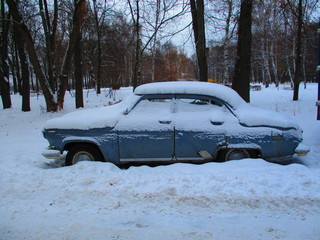 vintage russian car abandoned in snow in winter