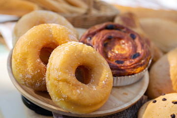 assorted breads  on a wooden background.