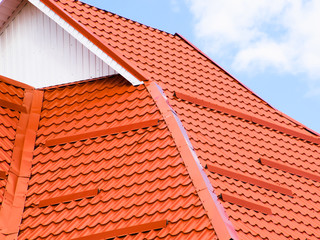 The roof of corrugated sheet red orange