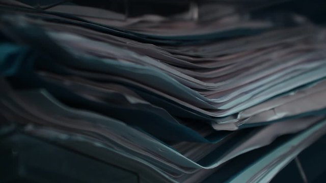 Close up of stack of documents, papers, files in the office.