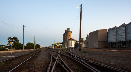 Fototapeta na wymiar Railway tracks leading to silos