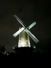 old windmill on background of blue sky