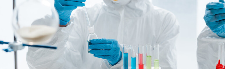 panoramic shot of scientists in latex gloves doing dna test in lab - obrazy, fototapety, plakaty