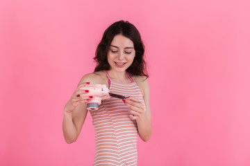 Young brunette girl looks at a picture taken on an instant camera