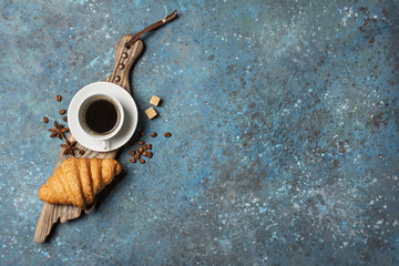 Appetizing crispy croissant and coffee for tasty breakfast