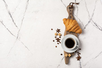 Appetizing crispy croissant and coffee for tasty breakfast