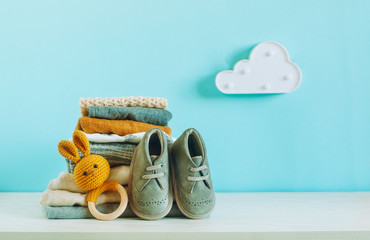 Organic cotton baby clothes on the shelf in the kids room