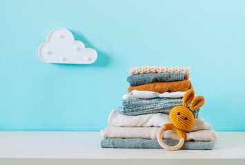 Organic cotton baby clothes on the shelf