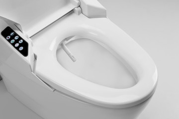 Toilet bowl with electronic high technology. White toilet bowl. Japan toilet electronic control bidet. - obrazy, fototapety, plakaty