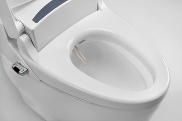Toilet with electronic high technology. White toilet bowl. - obrazy, fototapety, plakaty