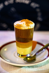 Special coffee of Canary islands, sweet barraquito coffee with layers and alcohol served in glass