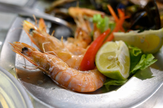 Cooked langoustine shrimps served with lemon