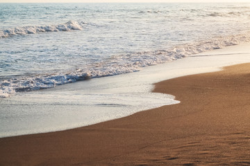 sea wave on the shore in sunlight