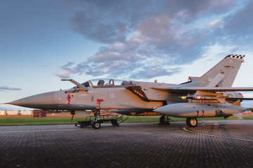 Fototapeta na wymiar Military jet at dusk