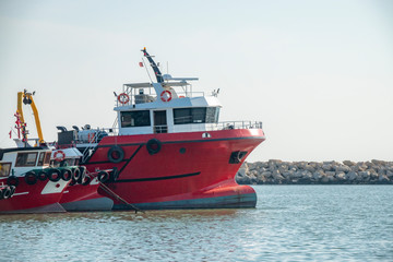 red colored fishing boats in harbor