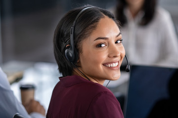 Woman wearing headset in call center