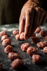 man preparing meatballs