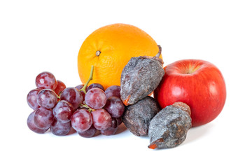 Grape, apple, orange and dry persimmon isolated on white background.