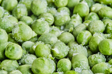 Frozen green peas with pieces of ice. Healthy Food. Shallow focus. Close-up. Macro.