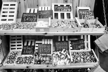 Mushrooms at market in London UK. Black and white retro toned.