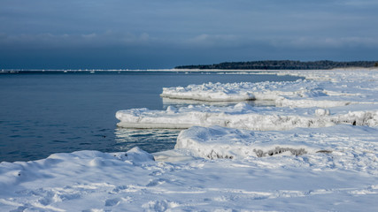 frozen winter sunset seascape with ice and colored the sky in estonia