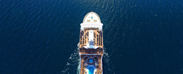 Aerial drone ultra wide photo of huge cruise liner in Mediterranean blue sea
