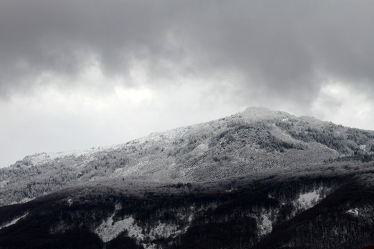 A mountain peak in the snow. Bad grey weather. Vitosha mountain. © Radila