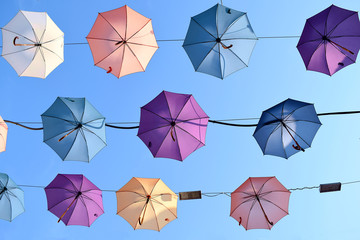 Umbrellas Street in old town of Antalya in Turkey. Colorful umbrellas on the blue sky.