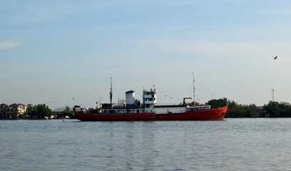 Fototapeta premium Picture of a large red boat on the river On a sunny day