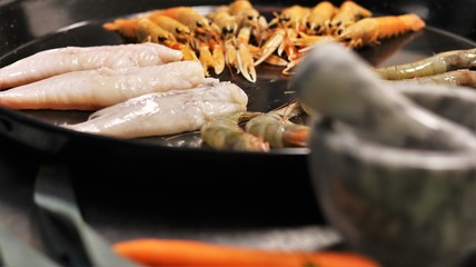 Vegetables and Fish used to cook Paella in the typical Spanish Way. This Spanish speciality can be made with seafood or meat