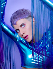 Futuristic Fashion Model with violet short hair. Trendy hair style