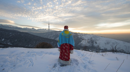 Santa Claus in winter with the flag of Kazakhstan