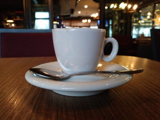 cup of coffee on wooden table