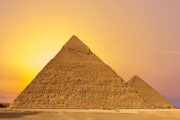 Naklejka na ściany i meble Famous great Giza Pyramids in sand desert in Cairo. 