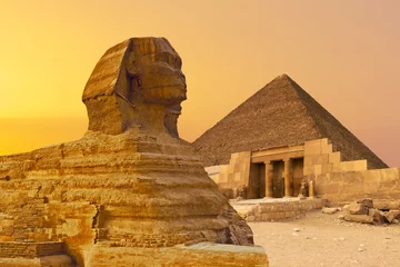 Foto op Canvas Sphinx against the backdrop of the great Egyptian pyramids. Africa, Giza Plateau.  © Mountains Hunter