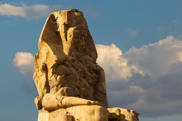 Colossi of Memnon Luxor Thebes against the background of dawn in the Egypt