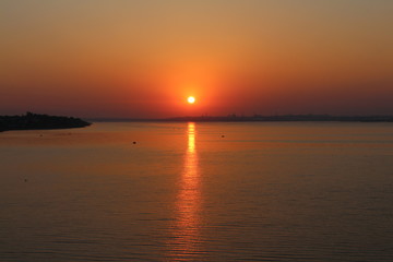 Beautiful sun over the horizon of the river