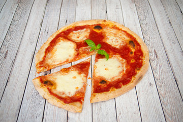 Pizza margherita basil slice 