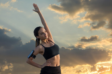 A young slim athletic girl in sportswear with snakeskin prints performs a set of exercises. Fitness...