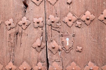 Old wooden door with keyhole. Andalusia Spain