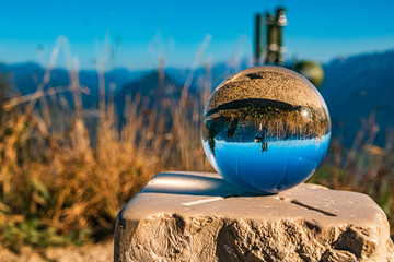 Crystal ball on a landmark alpine landscape shot at the famous Rossfeldstrasse, Berchtesgaden, Bavaria, Germany
